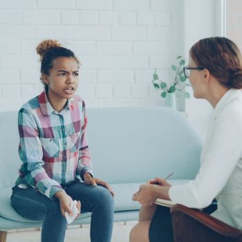 therapist-consulting-with-patient-in-office